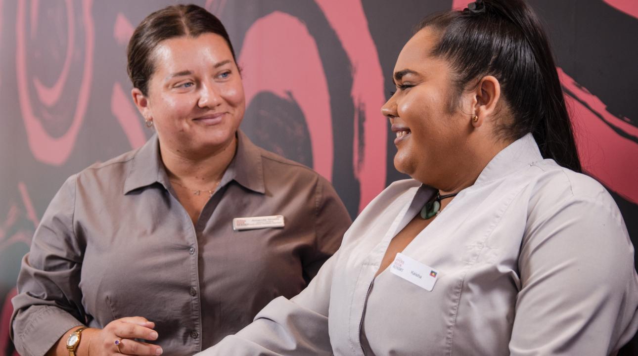 Two women smiling